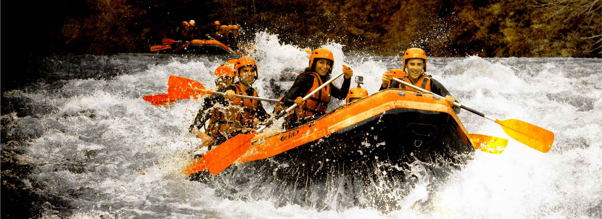 Two rafts following each other in the Bourg-Saint-Maurice rapids. Happiness can be seen on their faces